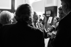 Guests enjoying animated conversation at the reception