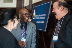 NFCR scientist Dr. Paul Fisher and his wife Marlene are all smiles with Mr. Charles Weatherspoon