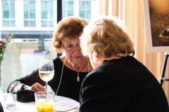 Two loyal donors, Ms. Betty Locke from California, is captivated by Nancy Cole of Bethesda