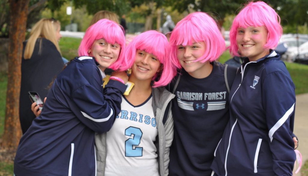 High School Athletes in Pink Wigs